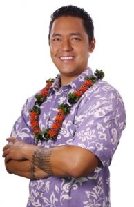 Photo of patron Kaiwi wearing a lei