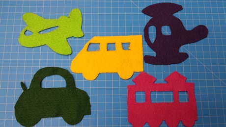 felt cut outs of different transportation vehicles