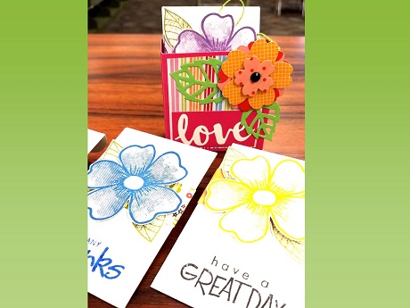 Gift card envelopes embellished with flowers and greetings.