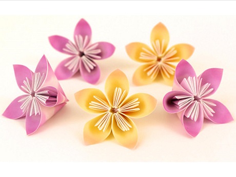 five intricately folded flowers