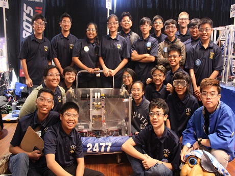 Waipahu robotics team photo posing with their robot