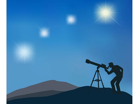 Astronomer through telescope to the sky