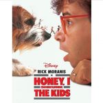 A picture of a dog and man nose to nose looking at each others faces. Miniature sized teenagers are walking across the dog's nose to the man's nose.
