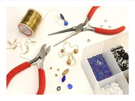 Picture of sewing thread, pliers and buttons