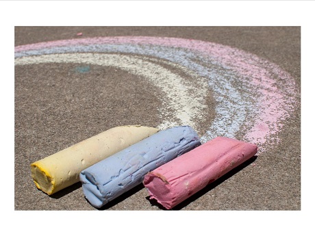 Chalk coloring a sidewalk