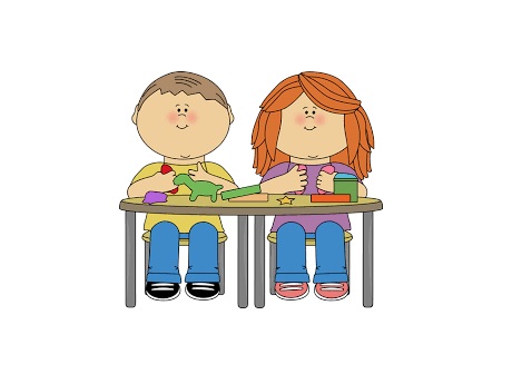 Male and female students sitting at a desk.