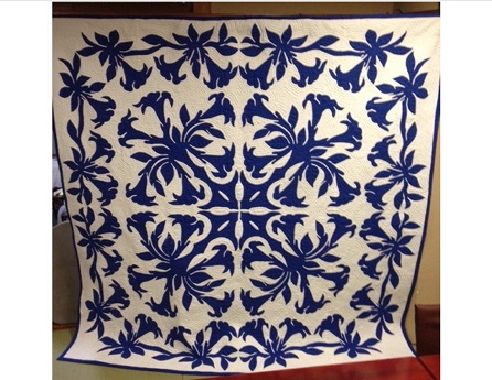 photo of blue and white Hawaiian quilt