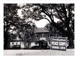 Black and white photo of a house with peace corps sign