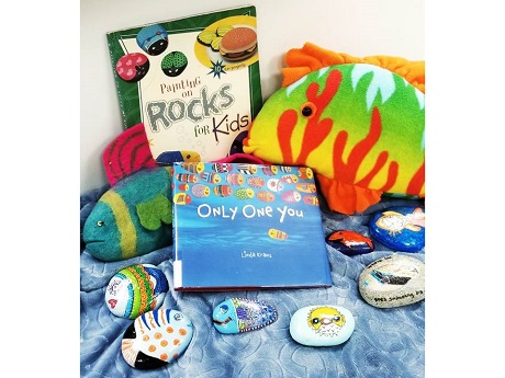 examples of painted rocks with the book "Only one you".