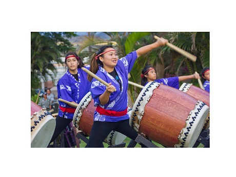 Three women drumming