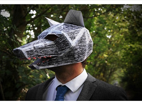 Man wearing paper wolf mask