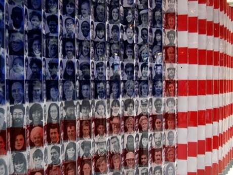 Stylized American flag containing photo collage of immigrants' faces