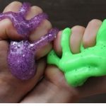 Two hands holding slime