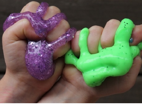 Two hands holding slime