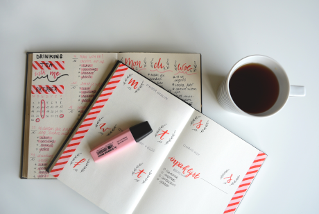 Journal and coffee cup