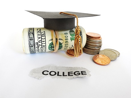 Graduation cap with money roll and coins