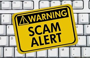Warning signs says "scam alert"