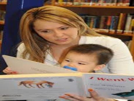 Woman reading to infant