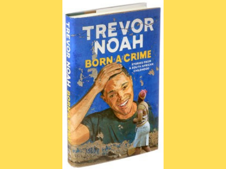 Photograph of the memoir Born a Crime by Trevor Noah, with a yellow background.