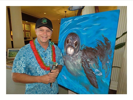 Portrait of the artist in front a Hawaiian Monk Seal painting