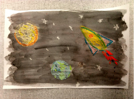 Crayon solar system drawing with ink background