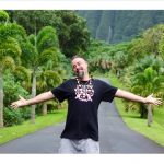 Mr. Kneel smiling with outstretched arms
