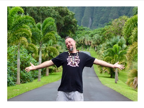 Mr. Kneel smiling with outstretched arms