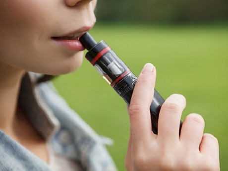 Female holding a vaping device