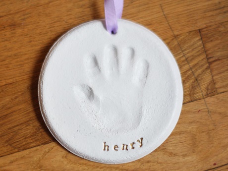 clay handprint labeled "henry"