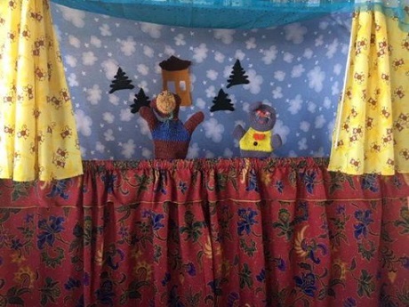 puppet show in snowy background