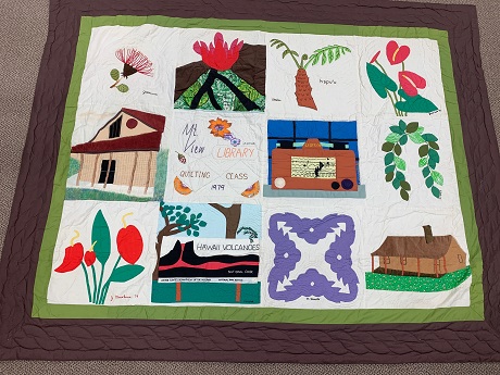 Mountain View Quilting Class Quilt with volcano, houses, greenery and patterns