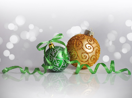 Green and gold ornaments with curly green ribbon