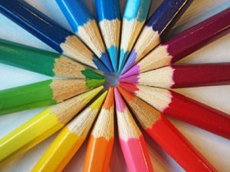 color pencils pointed together to make a colorful circle design