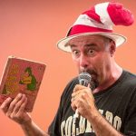 Mr. Kneel wearing a striped a "Cat in the Hat" hat