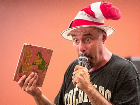 Mr. Kneel wearing a striped a "Cat in the Hat" hat