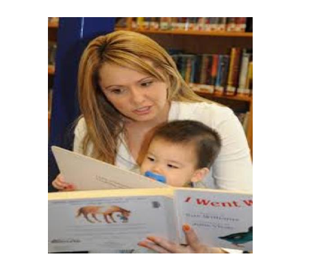 Woman reading to a toddler