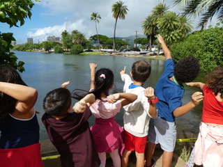 Kids pointing to towards the Ala Wai Canal