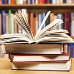 Stack of books on a library table