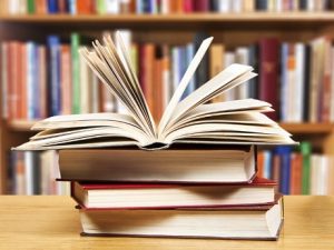 Stack of books on a library table