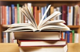 Stack of books on a library table