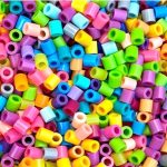 Loose colored Perler beads.