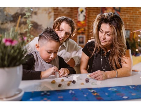 Parents schooling a male child