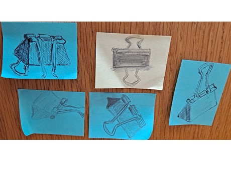 drawings of binder clips from different angles