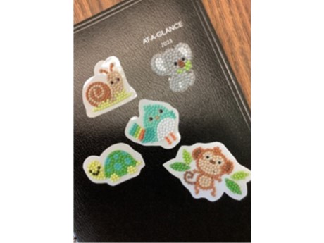 monthly planner decorated with a snail a koala a bird a turtle a monkey diamond stickers
