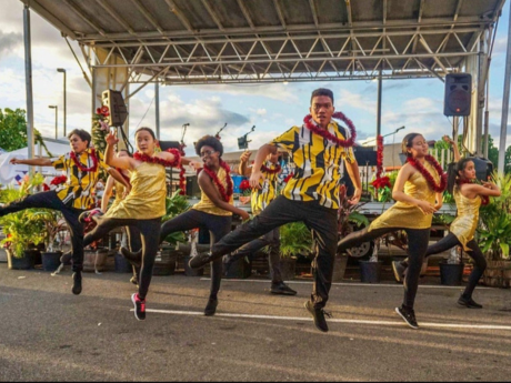 photo of nanakuli high and intermediate performing arts center dancing and singing at an event.