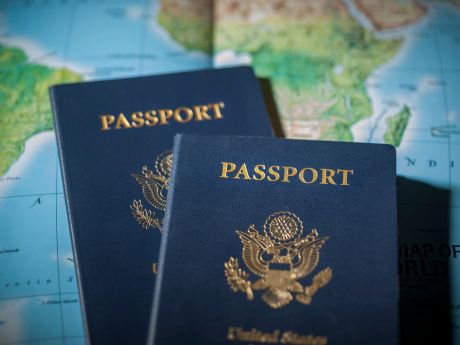 Two passports with world map