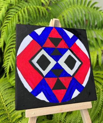 Red, blue, black and white mandala design