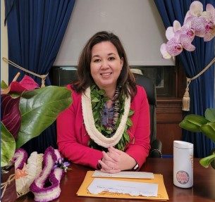 picture of Congresswoman Jill Tokuda sitting at a desk