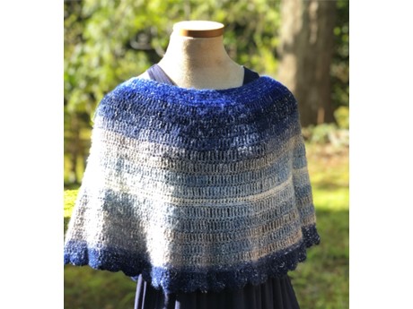 a blue crochet shawl