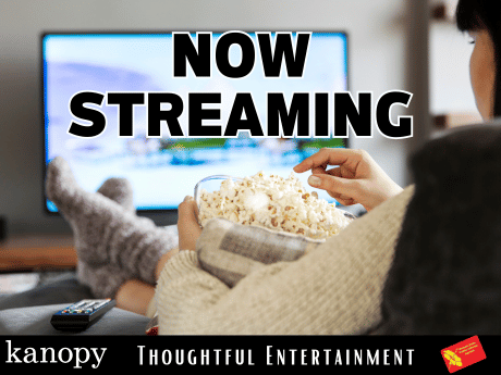 Woman watching television and eating popcorn. Text: Now Streaming thoughtful entertainment